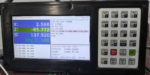 TNC-L32 controller, front panel, powered on and running a job